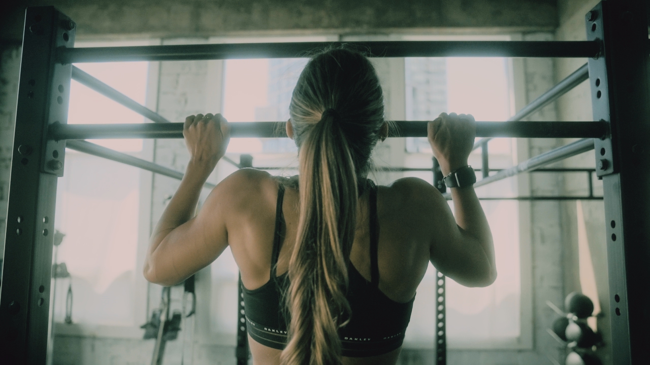 Woman stretching in a bright wellness studio